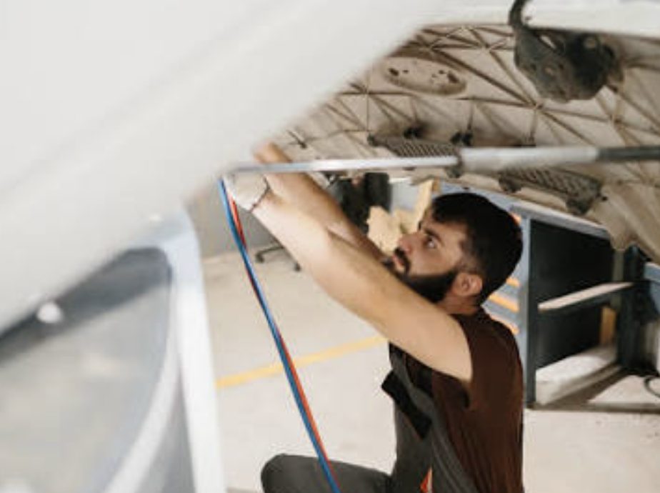 Engineering student working on a vehicle structure